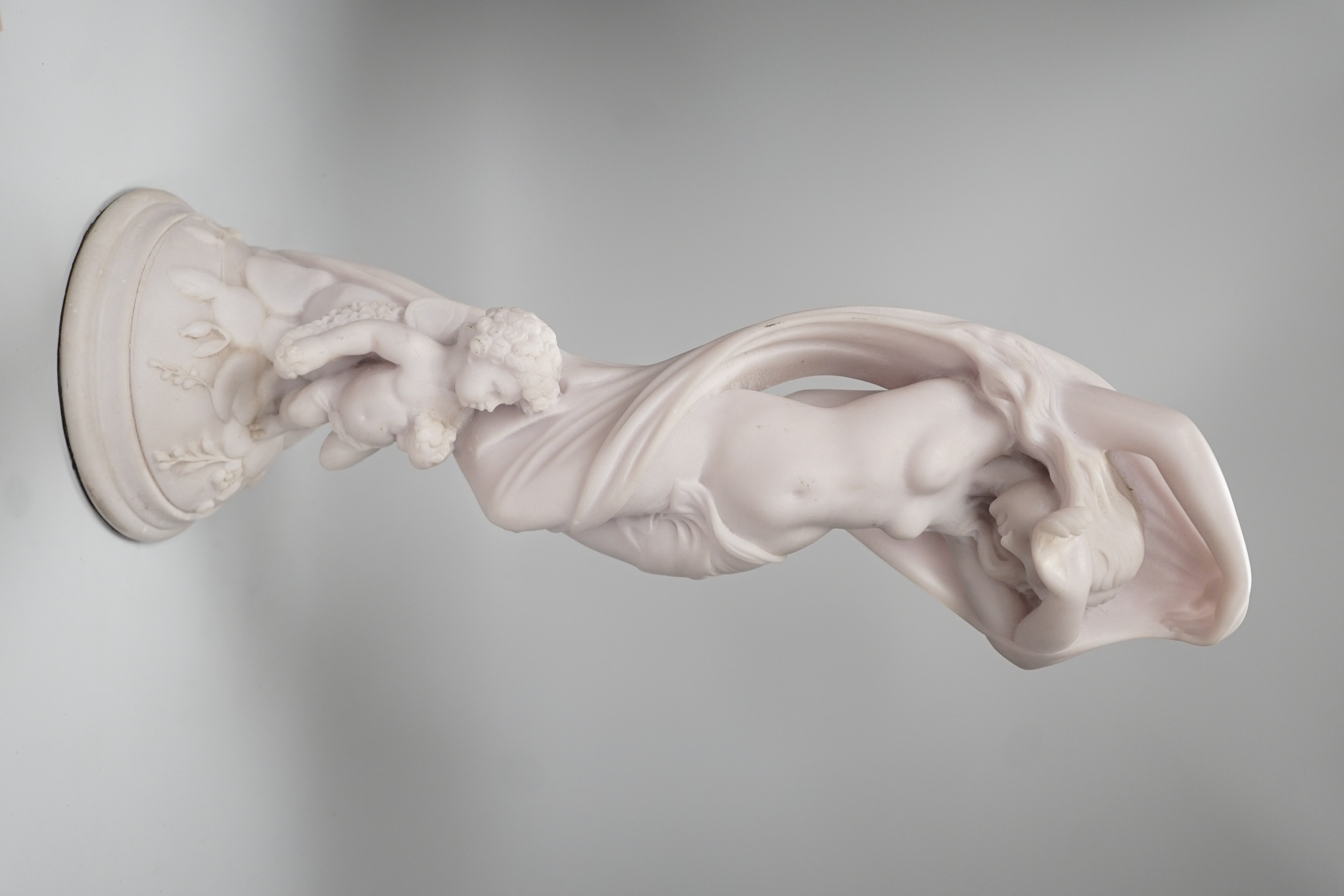 A resin marble figure of Venus and Cupid, 49cm high